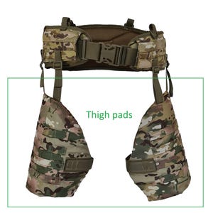 May include: A tactical vest and thigh pads set in a camouflage pattern. The vest features multiple pockets and adjustable straps. The thigh pads are designed to attach to the vest, offering additional protection and storage. The text "Thigh pads" is visible.