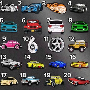 May include: A collection of twenty numbered shoe charms featuring various vehicles and automotive parts. Designs include a white truck, blue sports car, Hot Wheels logo, black car, teal car, red jeep, white SUV, green car, pink beetle, turbo, wheel, yellow jeep, white car, yellow car, blue car, yellow sports car, beige car, blue truck, yellow hot rod, and red car.
