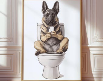 May include: A framed wall art print featuring a German Shepherd dog sitting upright on a white toilet. The dog is holding a white smartphone with both front paws, looking directly forward. The illustration uses a neutral color palette.