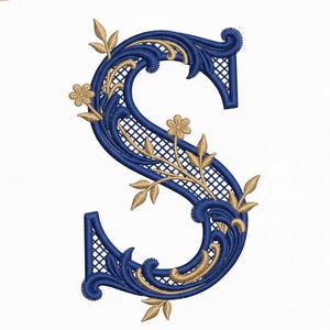 May include: Embroidered letter "S" in navy blue with gold floral accents. The letter features a decorative filigree design with a lattice pattern in the centre. Gold leaves and flowers are incorporated into the design, creating an elegant and ornate appearance.