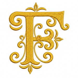 May include: A golden yellow embroidered letter F featuring intricate swirling filigree patterns and decorative flourishes at the top and bottom. The design is rendered in a dense satin stitch texture, creating a raised, three-dimensional appearance.
