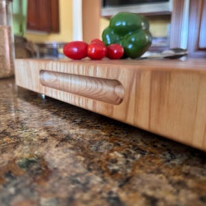 Premium heavy end grain maple butcher block cutting board, full board view highlighting the clean maple pattern, square edges, and smooth finish.