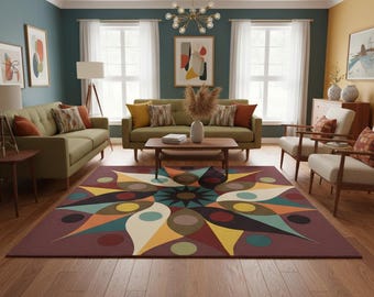 May include: A living room scene featuring a large, colorful geometric rug with a starburst design. The rug's pattern includes shades of burgundy, yellow, teal, and orange. The room also has olive green sofas, wooden furniture, and abstract art on the walls.