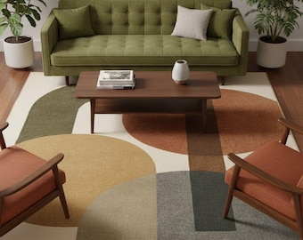 May include: A living room scene featuring a green tufted sofa, a wooden coffee table, and two armchairs with orange cushions. A large area rug with a geometric pattern in shades of green, brown, and gray sits on the floor. A round mirror hangs on the wall.