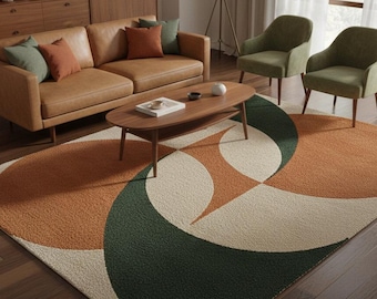 May include: A modern living room rug with a geometric design. The rug features a pattern of overlapping circles in shades of orange, green, and cream. The rug is placed in front of a brown leather sofa and two green armchairs.