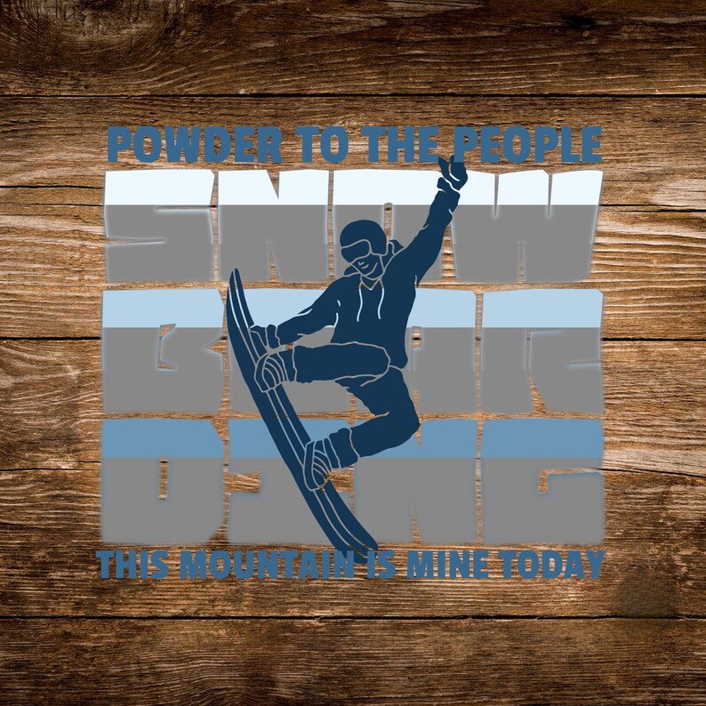 May include: A blue graphic design on a wooden background. The design features a snowboarder in mid-air with the text "POWDER TO THE PEOPLE", "SNOW IS DOING", and "THIS MOUNTAIN IS MINE TODAY". The snowboarder is wearing a helmet and goggles.
