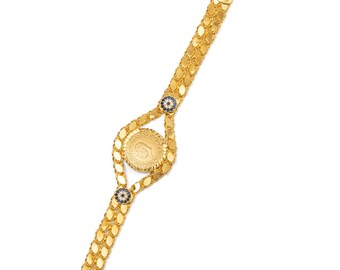 Pulsera artesanal con monedas chapadas en oro de 22 quilates y cadena Arpa ajustable.