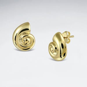 May include: A pair of gold-colored stud earrings. Each earring is shaped like a nautilus shell, with a spiral design. The earrings have a polished, reflective surface, and a post and butterfly backing.