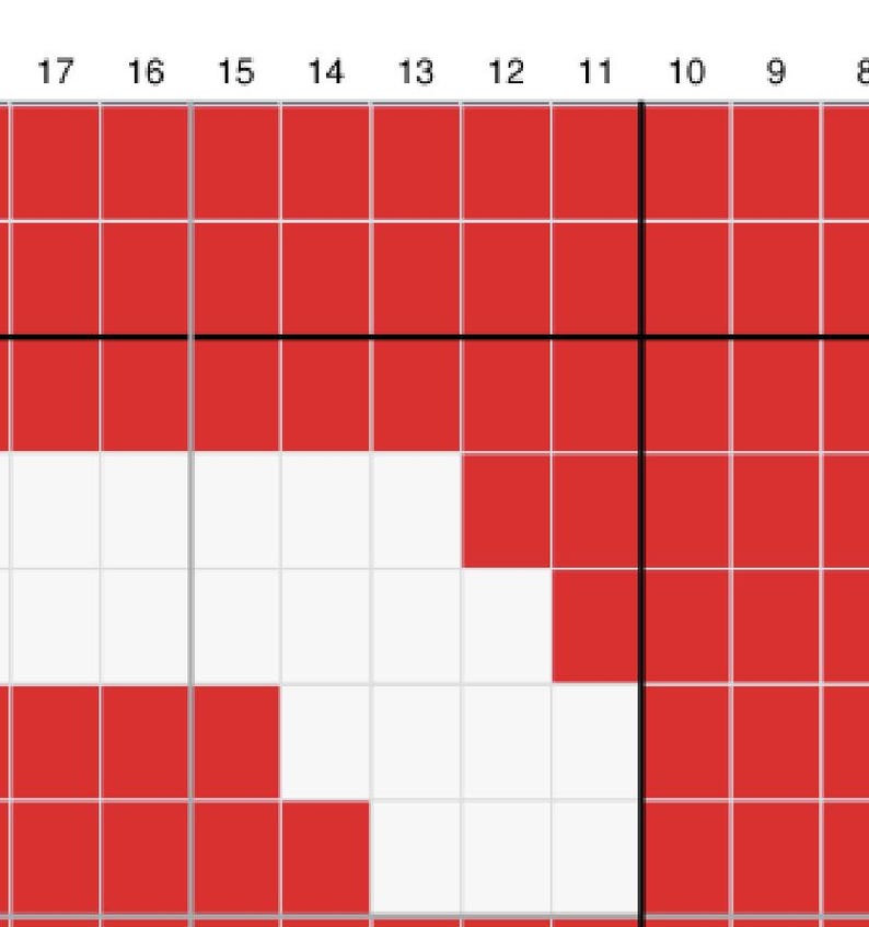 May include: A close-up of a cross-stitch pattern featuring a red and white design. The pattern is divided into a grid of squares, with the white squares forming a cross shape against a red background. The image is a close-up of the cross-stitch.
