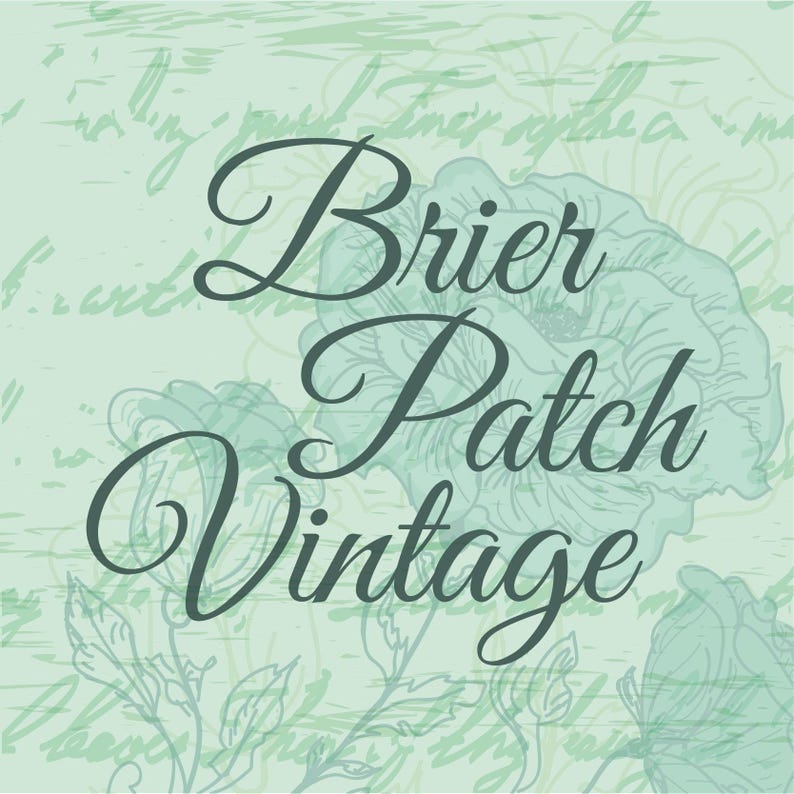 May include: A vintage-style graphic with the words "Brier Patch Vintage" in elegant script. The background is a soft green with floral and handwritten script elements, creating a classic, antique aesthetic.