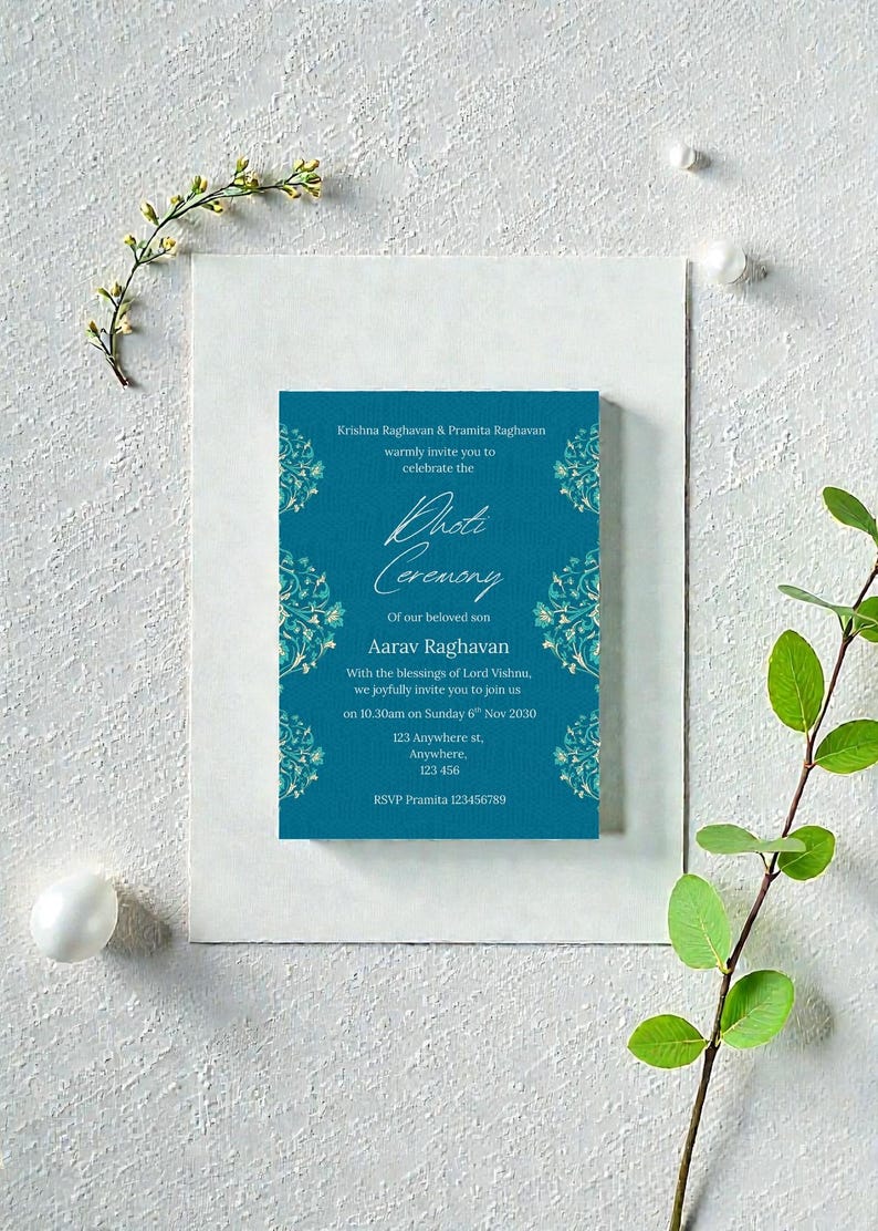 May include: A teal invitation card for a Dhot Ceremony, with ornate floral designs. The card includes the names Krishna Raghavan and Pramita Raghavan, and the name Aarav Raghavan. The invitation is on a white background with floral accents.