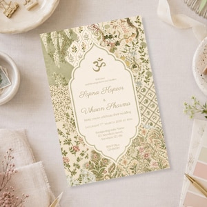 May include: A rectangular wedding invitation card featuring a central ornate frame with an Om symbol and the text Sapna Kapoor & Vihaan Sharma, surrounded by a detailed botanical pattern in shades of sage green, cream, and muted pink floral motifs.