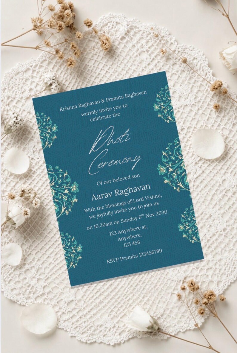 May include: Teal invitation card with floral corner designs. The card announces a 'Photi Ceremony' for Aarav Raghavan, with details including the date, time, and location. The card is decorated with floral accents.