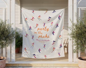 May include: White fabric banner with a ski-themed design. The banner features illustrations of skiers and snowboarders in various poses, with the text "party on the peaks" in orange script. Additional text reads "Olivia's bachelorette, Snowbird, UT, est. 2023".