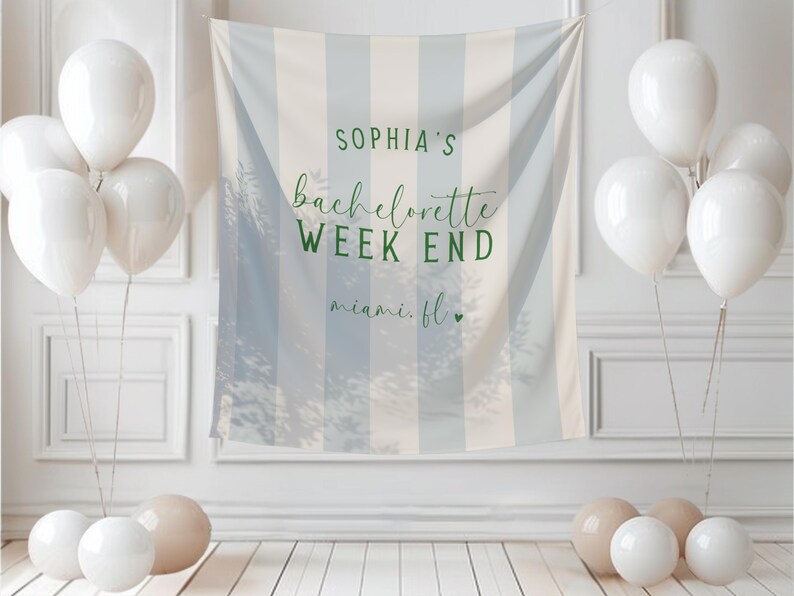 May include: A white and blue striped backdrop with the text "SOPHIA'S bachelorette WEEK END miami. fl." is surrounded by white balloons and beige and white orbs. The backdrop is hanging on a white wall.