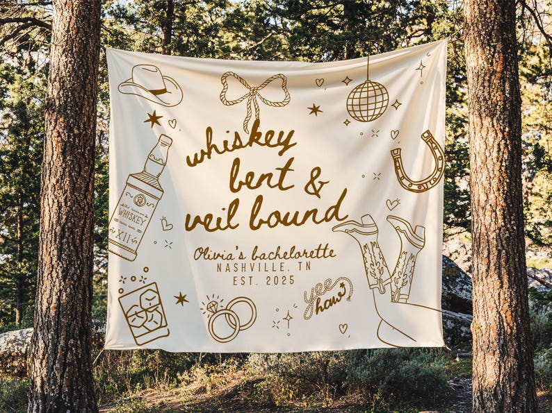 May include: Cream-colored banner with brown illustrations and text for a bachelorette party. The banner includes drawings of a cowboy hat, whiskey bottle, disco ball, horseshoe, cowboy boots, and rings. Text reads "whiskey bent & veil bound" and "Olivia's bachelorette Nashville, TN EST. 2025."