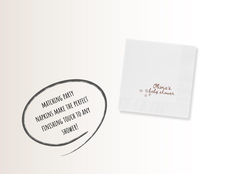 May include: White square napkin with the text "Olivia's baby shower" in brown script. The napkin has a decorative border and small brown dots. A speech bubble with the text "MATCHING PARTY NAPKINS MAKE THE PERFECT FINISHING TOUCH TO ANY SHOWER!" is also present.