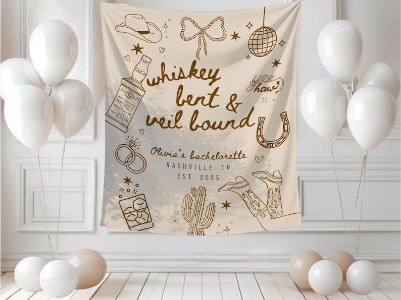 May include: A beige bachelorette party backdrop with the text "whiskey bent & veil bound" and illustrations of a cowboy hat, boots, and a horseshoe. White balloons and decorative elements complete the scene.