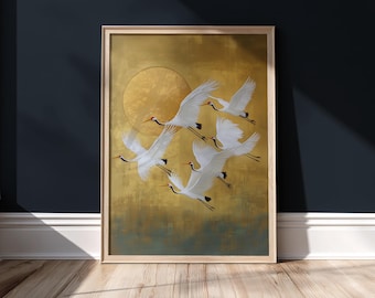 May include: A framed artwork featuring a flock of white cranes in flight against a gold background with a circular sun design. The artwork has a wooden frame and is displayed against a dark blue wall.