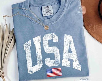 Koszulka retro USA, damska koszulka z USA w komfortowych kolorach, koszulka z motywem Ameryki, koszulka z okazji 4 lipca, koszulka patriotyczna w stylu vintage, koszulka z podartą flagą USA