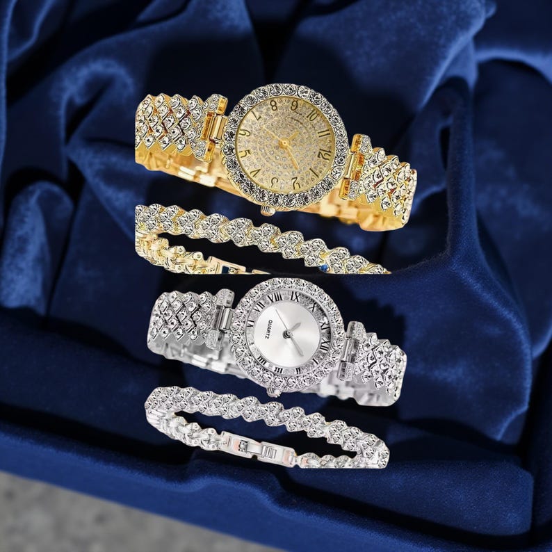 May include: Two watches and two bracelets. One watch is gold-toned with a gold face and crystal accents. The other watch is silver-toned with a white face and crystal accents. The bracelets match the watch tones and have crystal accents.