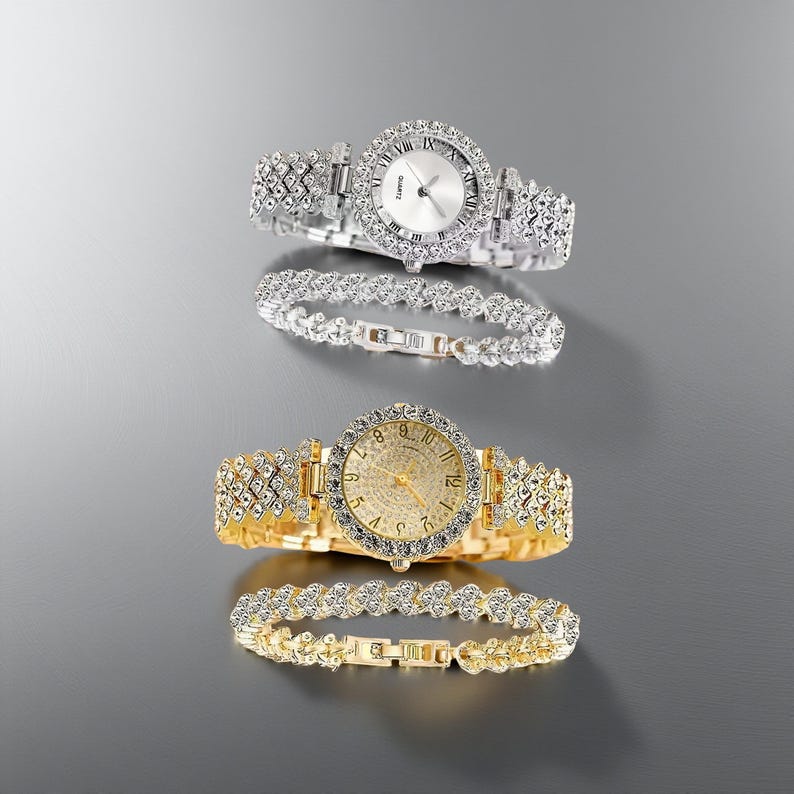 May include: Two elegant quartz watches and matching bracelets. One watch is silver-toned with a white face and Roman numerals, the other is gold-toned with a gold face and Arabic numerals. Both are adorned with sparkling crystals.