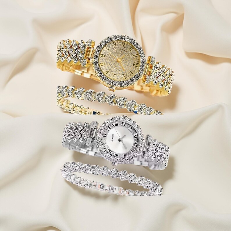 May include: Two elegant wristwatches and matching bracelets. One watch is gold-toned with a gold dial and crystal accents. The other is silver-toned with a white dial and crystal accents. Both have crystal-studded bands.