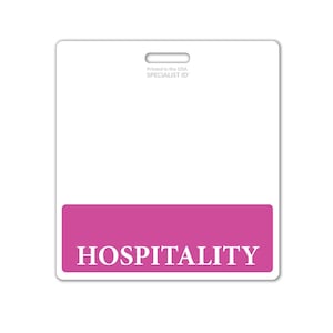 May include: White plastic badge with a pink bar at the bottom that says "HOSPITALITY" in white text. The top of the badge says "Printed in the USA SPECIALIST ID".