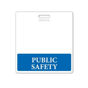 May include: White plastic blank ID card with a blue bar at the bottom that says "PUBLIC SAFETY" in white text. The card has a hole at the top for a lanyard. The text "Printed in the USA SPECIALIST ID" is printed in the top right corner.