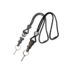 May include: Black lanyard with a black breakaway clasp and a silver hexagonal charm with the text "SP10" on it. The lanyard has a black ring on one end and a silver ring on the other end.