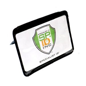 May include: Black plastic ID card holder with a clear window to display an ID card. The holder has the logo "Specialist ID Inc." printed on the front.