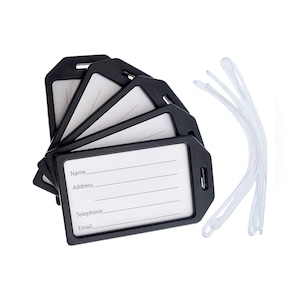 May include: Set of five black luggage tags with white writing areas. The tags have spaces for name, address, telephone, and email. The set also includes five white lanyards.