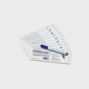 May include: A stack of white ID card printer cleaning cards with a blue and white cleaning pen. The text "ID card printer CLEANING CARD" is printed on the cards. The pen is lying on top of the cards.