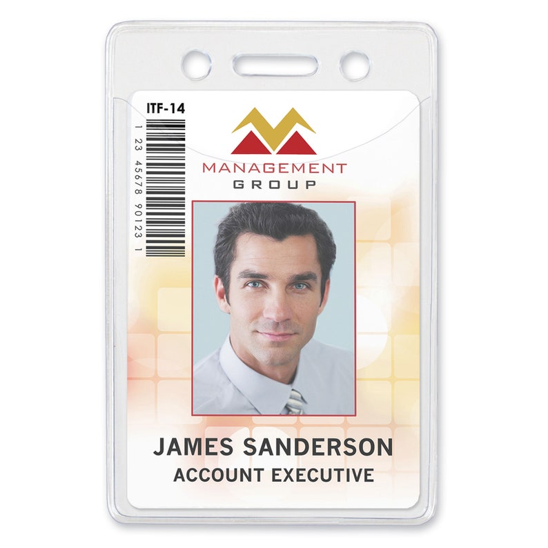 May include: A white plastic ID card holder with a clear front and a pocket on the back. The holder has two holes at the top for a lanyard. The ID card inside the holder has a barcode, a company logo, and a photo of a man. The text on the card reads "ITF-14", "MANAGEMENT GROUP", "JAMES SANDERSON", and "ACCOUNT EXECUTIVE".