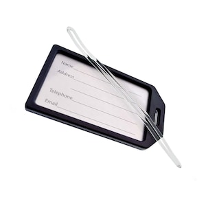 May include: Black luggage tag with a clear plastic strap. The tag has spaces for writing a name, address, telephone number, and email address.