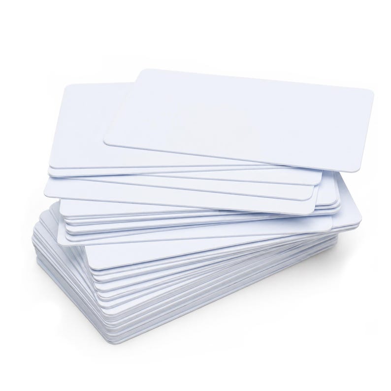 May include: A stack of blank, white rectangular cards with rounded corners. The cards are neatly arranged, showing a clean, minimalist aesthetic. The cards are stacked on top of each other.