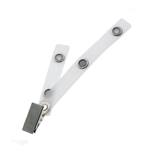 May include: White plastic badge holder with a silver clip and three metal eyelets.