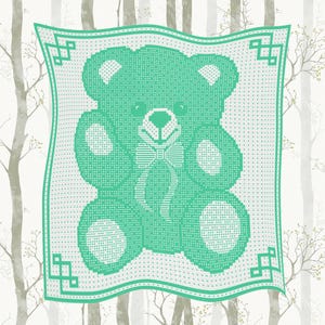 May include: A mint green and white crocheted baby blanket featuring a teddy bear design. The bear has a bow tie and is surrounded by a decorative border. The blanket is square-shaped and set against a backdrop of a forest.