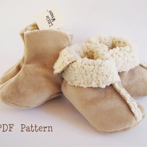 May include: A pair of beige suede baby booties with a white faux fur lining. The booties have a fold-over cuff and are labelled "Little Wraps". PDF Pattern.