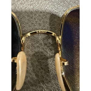 Gafas de sol Ray Ban RB 1971 con montura cuadrada dorada y lentes marrones, modelo 54019, fabricadas en Italia. imagen 10