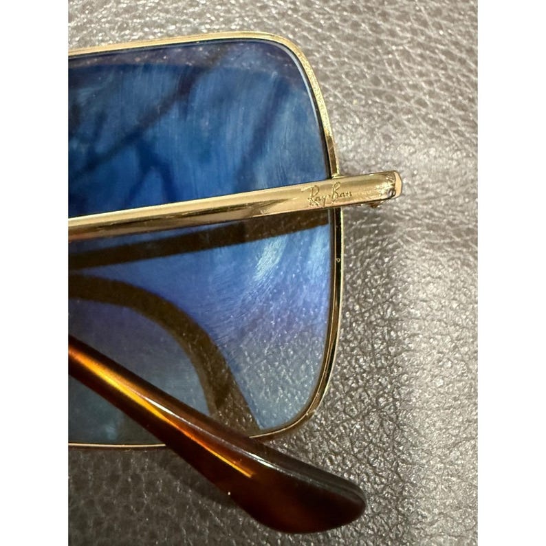 Gafas de sol Ray Ban RB 1971 con montura cuadrada dorada y lentes marrones, modelo 54019, fabricadas en Italia. imagen 7