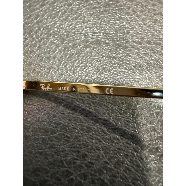 Gafas de sol Ray Ban RB 1971 con montura cuadrada dorada y lentes marrones, modelo 54019, fabricadas en Italia. imagen 9