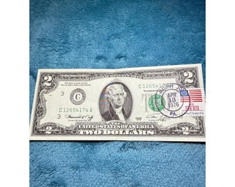 Billete de dos dólares de la serie 2 de 1976, sellado el primer día de emisión, 13 de abril de 1976, PA Bank.