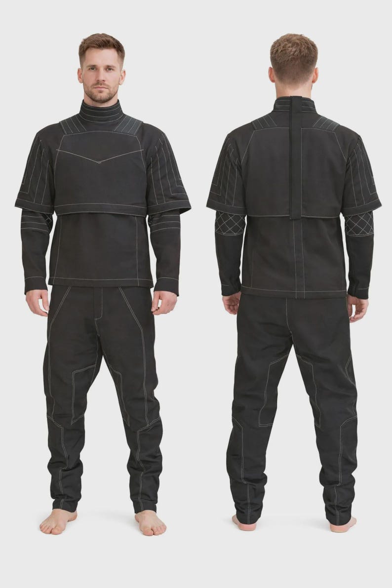 May include: A black two-piece outfit consisting of a long-sleeved top and matching pants. The top features a high collar, a layered chest panel, and white contrast stitching. The pants have a structured fit with white seam detailing throughout.
