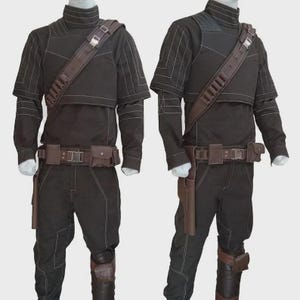 May include: A black long-sleeved shirt and pants set featuring white contrast stitching, a high collar, and a brown utility belt with pouches and a holster. A brown shoulder strap with metallic buckles and loops is worn across the chest.