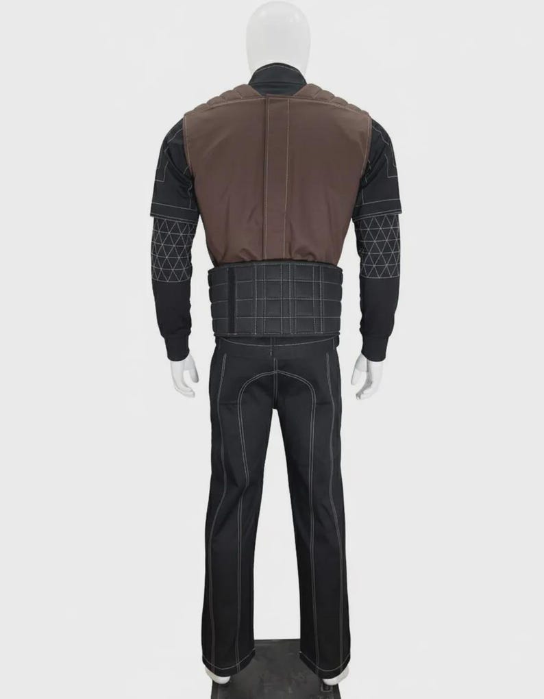 May include: A full-body costume set featuring a black long-sleeved top with white geometric stitching on the sleeves, a brown vest with quilted shoulder detailing, a black waist belt with a grid pattern, and matching black trousers with white seams.