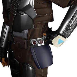 May include: A brown tactical jumpsuit featuring metallic silver chest and shoulder armor, black gauntlets with a light blue triangular accent, a utility belt with two circular red-centered buttons, and a dark blue thigh plate accessory.