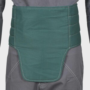 May include: A dark green, wide, quilted abdominal support belt featuring horizontal stitching and white contrast thread. The belt has a contoured, extended front panel that covers the lower torso area, worn over dark gray trousers and a dark shirt.