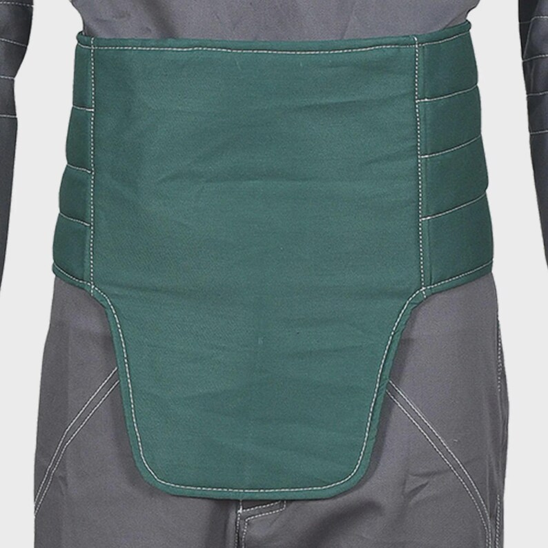 May include: A dark green, wide, quilted abdominal support belt featuring horizontal stitching and white contrast thread. The belt has a contoured, extended front panel that covers the lower torso area, worn over dark gray trousers and a dark shirt.