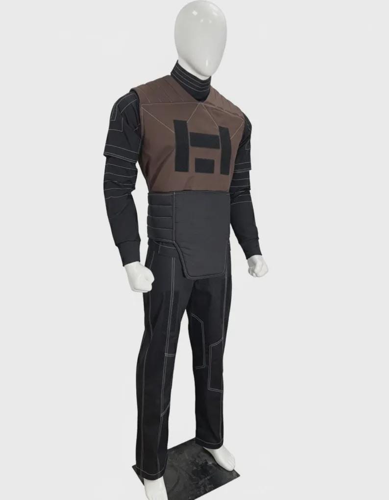 May include: A costume set featuring a brown chest piece with a black H-shaped emblem, a black turtleneck long-sleeve shirt with white horizontal line patterns, a black padded waist guard, and black trousers with white contrast stitching details.